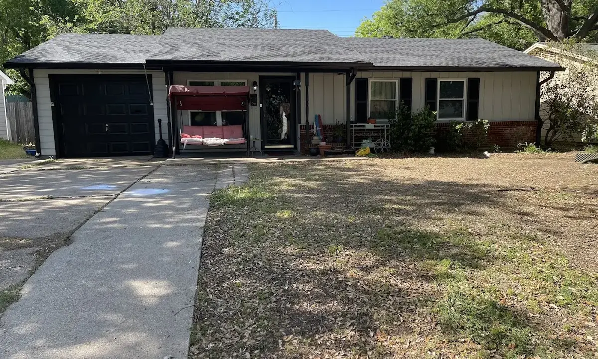 Asphalt Shingle Roof Repair crew at work on a residential roof in Callaway